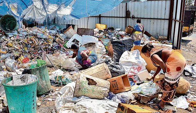 Sanitation workers are seen segregating garbage at the Balewadi sorting shed. The city needs at least 300 such sorting sheds as against 68, which are operational now. (Milind Saurkar/HT Photo) Sanitation workers are seen segregating garbage at the Balewadi sorting shed. The city needs at least 300 such sorting sheds as against 68, which are operational now. (Milind Saurkar/HT Photo)