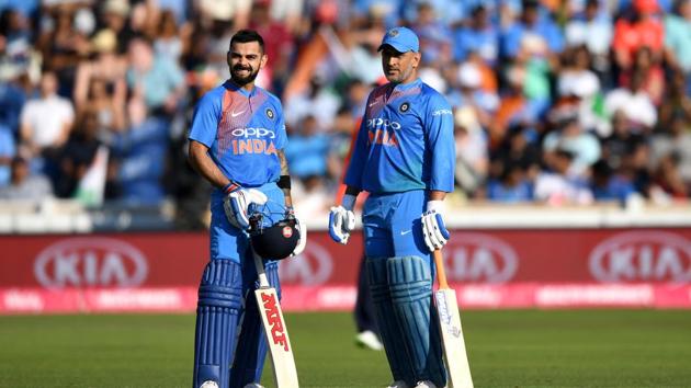 CARDIFF, WALES - JULY 06: MS Dhoni and Virat Kohli of India during the 2nd Vitality International T20 match between England and India at SWALEC Stadium on July 6, 2018 in Cardiff, Wales. (Photo by Gareth Copley/Getty Images)(Getty Images)
