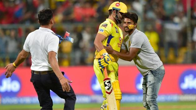 A pitch invader rush to CSK batsman Suresh Raina. (PTI)