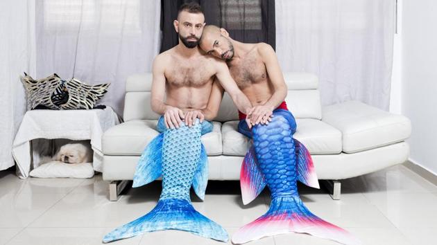 Adi Kazav (L), and Lied Adi Hagbi pose for a portrait at their home in Netanya, Israel. Now, as a 34-year-old “full-time mermaid,” Katzenell sells brightly-colored tails, some with dizzying $800 price tags, and teaches people swimming in them. The tail-clad group convenes regularly to romp in public pools across the country and participate in demonstrations to raise awareness about ocean preservation. (Oded Balilty / AP)