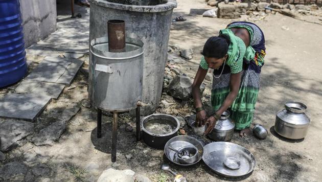 A woman cleans utensils outside her house in the village of Sawantwadi in Beed. In Beed though, the top issue is clear for residents like 23-year-old Reshma Sawant. Her husband killed himself, unable to pay debt borrowed at about 5% a month, leaving her with a daughter and 300,000 rupees of debt. “I will vote for someone who helps me, provides me with a house and a job,” Sawant said. (Dhiraj Singh / Bloomberg) A woman cleans utensils outside her house in the village of Sawantwadi in Beed. In Beed though, the top issue is clear for residents like 23-year-old Reshma Sawant. Her husband killed himself, unable to pay debt borrowed at about 5% a month, leaving her with a daughter and 300,000 rupees of debt. “I will vote for someone who helps me, provides me with a house and a job,” Sawant said. (Dhiraj Singh / Bloomberg)