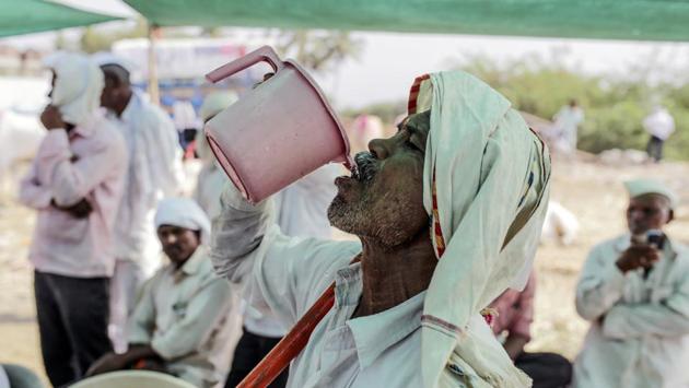 A man drinks water at a cattle market in Beed. “There are two narratives tugging at voters, not only in Maharashtra but all of India,” said Sudha Pai, a political science professor at New Delhi’s Jawaharlal Nehru University. “One is that of lack of jobs and the agrarian crisis. And the other is the sentimental pull of identity and national security.” (Dhiraj Singh / Bloomberg) A man drinks water at a cattle market in Beed. “There are two narratives tugging at voters, not only in Maharashtra but all of India,” said Sudha Pai, a political science professor at New Delhi’s Jawaharlal Nehru University. “One is that of lack of jobs and the agrarian crisis. And the other is the sentimental pull of identity and national security.” (Dhiraj Singh / Bloomberg)