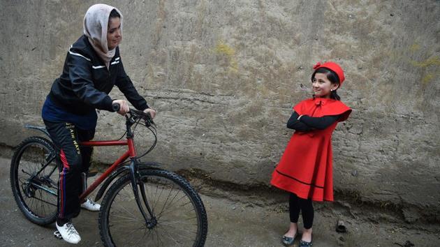Kobra Samim, who rides for Afghanistan’s national cycling team, wrote on Facebook that women’s participation in sport is her “red line” as the US tries to forge a peace deal with the Taliban. “If the Taliban come back, we won’t have the right to education, sports, and we will even be banned from coming out of houses,” Samim, 23, told AFP before setting off along a run-down Kabul street. (Wakil Kohsar / AFP) Kobra Samim, who rides for Afghanistan’s national cycling team, wrote on Facebook that women’s participation in sport is her “red line” as the US tries to forge a peace deal with the Taliban. “If the Taliban come back, we won’t have the right to education, sports, and we will even be banned from coming out of houses,” Samim, 23, told AFP before setting off along a run-down Kabul street. (Wakil Kohsar / AFP)
