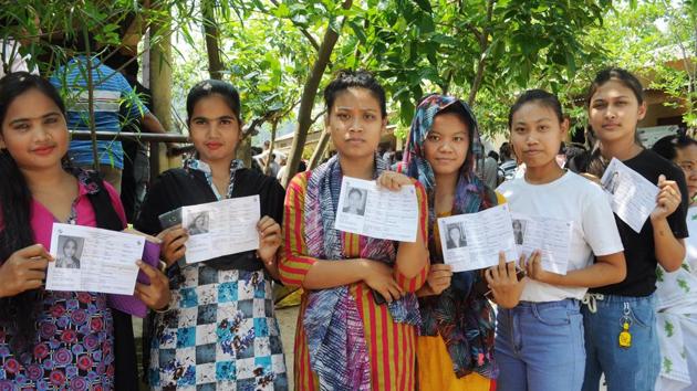 First time voters standing in queue and showing their ID Cards during the 3rd phase of polling during Lok Sabha Election 2019 in Guwahati on Tuesday. (ANI) First time voters standing in queue and showing their ID Cards during the 3rd phase of polling during Lok Sabha Election 2019 in Guwahati on Tuesday. (ANI)