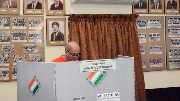 A man casts his vote at Bishop’s school in Pune. (Shankar Narayan/HT PHOTO) 