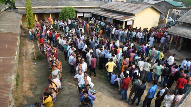 Voters stand in lines at a polling station in Guwahati, Assam. Voting is taking place for all 26 constituencies in Gujarat, all 20 seats in Kerala, 14 each in Maharashtra and Karnataka, 10 in Uttar Pradesh, seven in Chhattisgarh, six in Odisha, five each in Bihar and West Bengal, four in Assam, two in Goa, one each in Jammu and Kashmir, Dadra and Nagar Haveli, Daman and Diu and Tripura. (Biju Boro / AFP) Voters stand in lines at a polling station in Guwahati, Assam. Voting is taking place for all 26 constituencies in Gujarat, all 20 seats in Kerala, 14 each in Maharashtra and Karnataka, 10 in Uttar Pradesh, seven in Chhattisgarh, six in Odisha, five each in Bihar and West Bengal, four in Assam, two in Goa, one each in Jammu and Kashmir, Dadra and Nagar Haveli, Daman and Diu and Tripura. (Biju Boro / AFP)