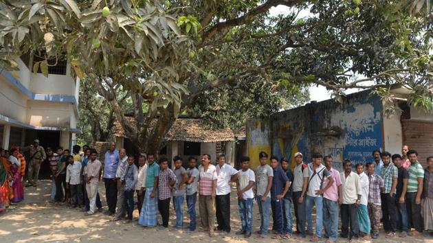 Voters at a polling station in Malda, West Bengal. An estimated 16.94% of over 80 lakh electorate exercised their franchise in the first two hours of polling in five Lok Sabha constituencies of West Bengal, an election official said. Barring a few isolated incidents of violence, polling has largely been peaceful in Balurghat, Maldaha Uttar, Maldaha Dakshin, Jangipur and Murshidabad Lok Sabha seats, he said. (Diptendu Dutta / AFP) Voters at a polling station in Malda, West Bengal. An estimated 16.94% of over 80 lakh electorate exercised their franchise in the first two hours of polling in five Lok Sabha constituencies of West Bengal, an election official said. Barring a few isolated incidents of violence, polling has largely been peaceful in Balurghat, Maldaha Uttar, Maldaha Dakshin, Jangipur and Murshidabad Lok Sabha seats, he said. (Diptendu Dutta / AFP)