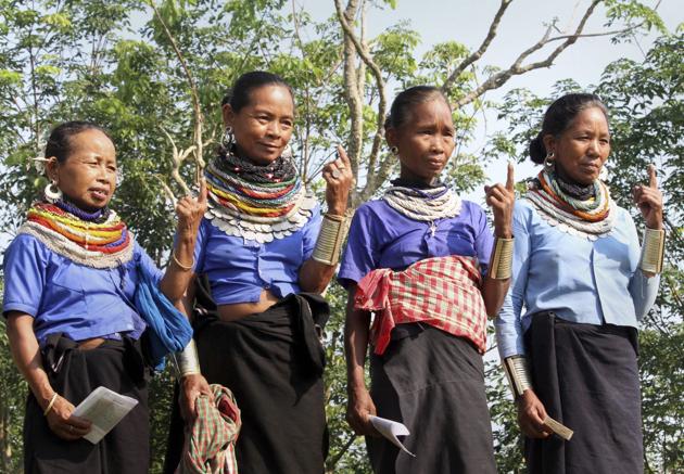 Women belonging to Reang tribal community show their inked marked finger after casting vote, during the third phase of the 2019 Lok Sabha elections, at polling station in Agartala. Voting began amidst heavy security at 7 a.m. and around 35 per cent voting was recorded till 12 p.m. The officials said that in around 100 polling stations, voting was temporarily halted due to the malfunctioning of either the Electronic Voting Machines (EVM) or the Voter-Verifiable Paper Audit Trail (VVPAT) machines. (PTI) Women belonging to Reang tribal community show their inked marked finger after casting vote, during the third phase of the 2019 Lok Sabha elections, at polling station in Agartala. Voting began amidst heavy security at 7 a.m. and around 35 per cent voting was recorded till 12 p.m. The officials said that in around 100 polling stations, voting was temporarily halted due to the malfunctioning of either the Electronic Voting Machines (EVM) or the Voter-Verifiable Paper Audit Trail (VVPAT) machines. (PTI)
