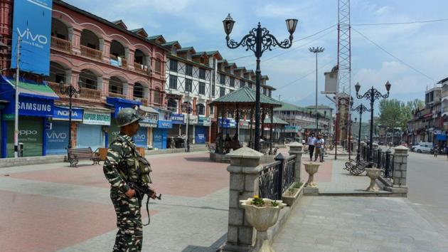 A security person stands guard on a deserted street during a strike called by the joint Hurriyat leadership against the suspension of cross LOC trade, and arrest of JKLF chief Yasin Malik by the NIA, in Srinagar. According to a news report, former Jammu and Kashmir chief ministers Mehbooba Mufti and Omar Abdullah have appealed to the Centre to immediately release Malik in view of his failing health. (PTI) A security person stands guard on a deserted street during a strike called by the joint Hurriyat leadership against the suspension of cross LOC trade, and arrest of JKLF chief Yasin Malik by the NIA, in Srinagar. According to a news report, former Jammu and Kashmir chief ministers Mehbooba Mufti and Omar Abdullah have appealed to the Centre to immediately release Malik in view of his failing health. (PTI)