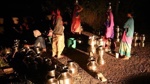 The groundwater in this area dries up between mid-April and mid-June. “There is no arriving at the water queue first…there’s always a queue here,” said 45-year-old Durpada Dhamne, a resident of Ghanichamata, who is at the hand pump every day at 4am. (Pramod Thakur / HT Photo) 