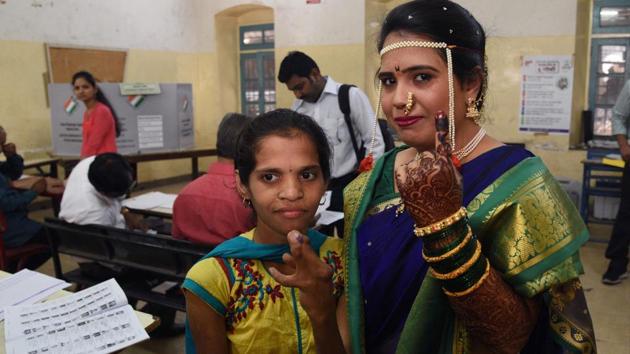 Shraddha Bhagat (R) casted her vote just before her wedding ceremony, at Nutan Marathi Vidyalay, Appa Balwant chowk on Tuesday. (Pratham Gokhale/HT Photo) Shraddha Bhagat (R) casted her vote just before her wedding ceremony, at Nutan Marathi Vidyalay, Appa Balwant chowk on Tuesday. (Pratham Gokhale/HT Photo)