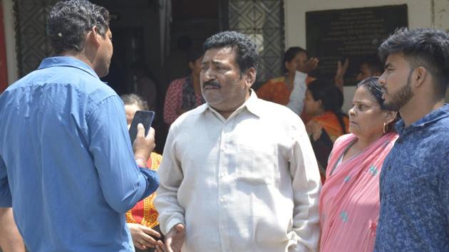 Family members of Anshu Bala at the Indirapuram police station in Ghaziabad. On the intervening night of Saturday and Sunday, Kumar allegedly served sedative-laced drinks to his wife Anshu Bala and his children and then slit their throats, the police said.(Sakib Ali/HT PHOTO)