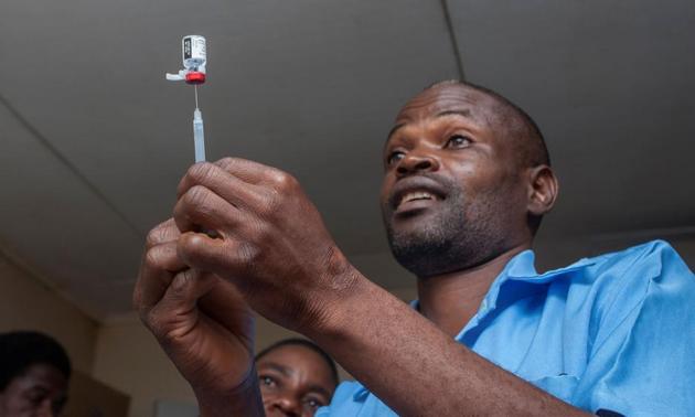 A health surveillance assistant gets malaria vaccine from its bottle into an injection to be administered to a child at the beginning of the Malaria vaccine implementation pilot programme at a hospital in Lilongwe, Malawi, April 23 (AFP) A health surveillance assistant gets malaria vaccine from its bottle into an injection to be administered to a child at the beginning of the Malaria vaccine implementation pilot programme at a hospital in Lilongwe, Malawi, April 23 (AFP)