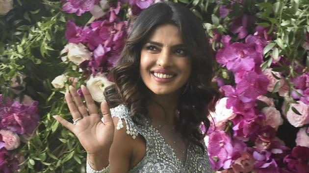 Bollywood actor Priyanka Chopra poses for photos as she arrives for the wedding ceremony of industrialist Mukesh Ambani's son Akash Ambani with Shloka Mehta, in Mumbai. (AP) Bollywood actor Priyanka Chopra poses for photos as she arrives for the wedding ceremony of industrialist Mukesh Ambani's son Akash Ambani with Shloka Mehta, in Mumbai. (AP)