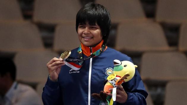 Bronze medalist Divya Kakran of India poses on the podium.(REUTERS)