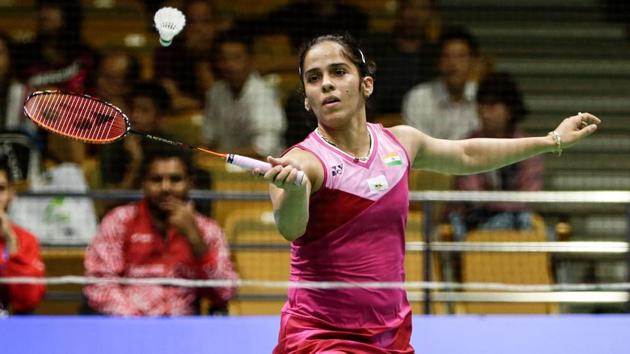 Saina Nehwal of India hits a return against Kim Ga-eun of South Korea during their women's singles second round match.(AFP)