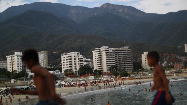 Children at Coral beach in La Guaira near Caracas. "A person who has a minimum wage can't come [to the beach]. The anguish that has all Venezuelans is food. First the flour and the rice." said Carla Cordova. The increased frequency of blackouts and a political showdown between the government and opposition has cast a cloud of uncertainty, leaving many Venezuelans bereft of simple pleasures. (Ivan Alvarado / REUTERS) 