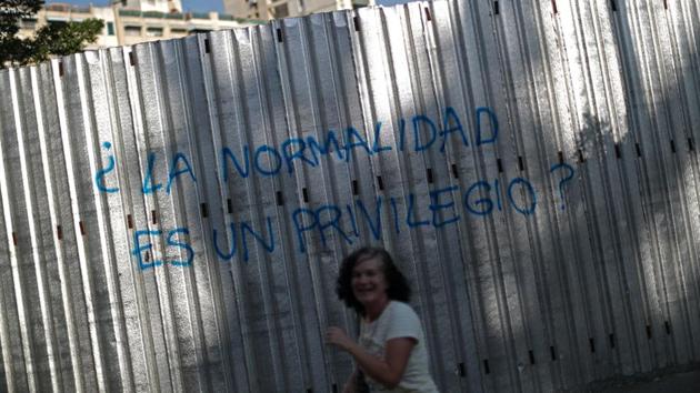 Belinda, a former teacher, laughs after taking a photograph of graffiti which reads ‘Normality is a privilege?’ in Caracas. Venezuela fell to the 108th place in the 2019 World Happiness Report prepared by the United Nations, down from 102nd place in 2018. In the Western hemisphere, only Haiti was below . The happiness report in its first edition in 2012 placed Venezuela 19th. (Ivan Alvarado / REUTERS) Belinda, a former teacher, laughs after taking a photograph of graffiti which reads ‘Normality is a privilege?’ in Caracas. Venezuela fell to the 108th place in the 2019 World Happiness Report prepared by the United Nations, down from 102nd place in 2018. In the Western hemisphere, only Haiti was below . The happiness report in its first edition in 2012 placed Venezuela 19th. (Ivan Alvarado / REUTERS)