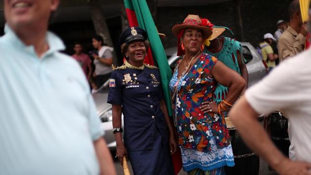At a parade in Caracas celebrating Holy Week, revellers in straw hats topped with flowers sang, banged drums and blew trumpets to tropical beats. The sun beating down, one marcher who gave his name as Carlos recalled how in past years onlookers would douse marchers with water to cool them down. “Now, because of the problems with the water, that probably will not happen,” he said. (Ivan Alvarado / REUTERS) At a parade in Caracas celebrating Holy Week, revellers in straw hats topped with flowers sang, banged drums and blew trumpets to tropical beats. The sun beating down, one marcher who gave his name as Carlos recalled how in past years onlookers would douse marchers with water to cool them down. “Now, because of the problems with the water, that probably will not happen,” he said. (Ivan Alvarado / REUTERS)