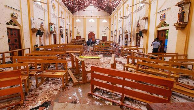 Crime scene officials inspect the site of a bomb blast inside St Sebastian's Church in Negombo, Sri Lanka, April 21, 2019(REUTERS)