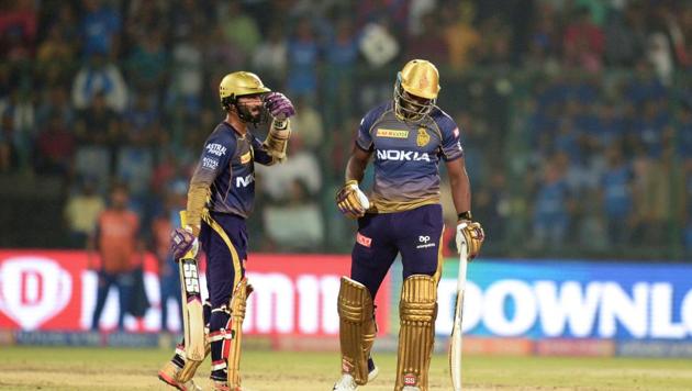 File image of Dinesh Karthik, Andre Russell (AFP) File image of Dinesh Karthik, Andre Russell (AFP)
