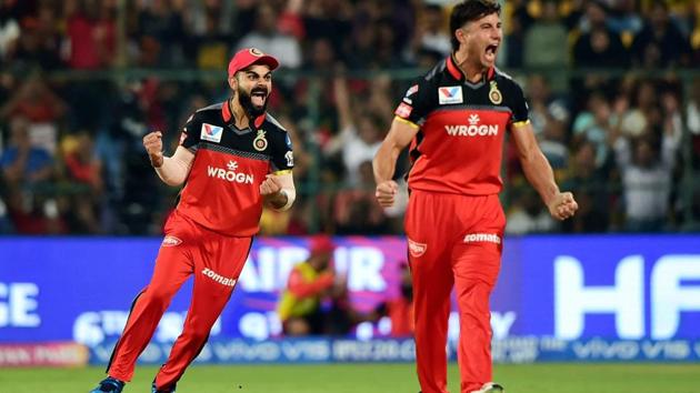 RCB bowler Marcus Stoinis and captain Virat Kohli celebrate after the dismissal of KXIP batsman Mayank Agarwal. (PTI) RCB bowler Marcus Stoinis and captain Virat Kohli celebrate after the dismissal of KXIP batsman Mayank Agarwal. (PTI)