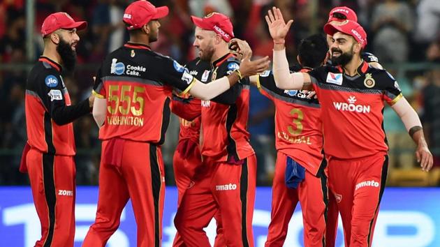 Bengaluru: RCB Skipper Virat Kohli celebrate with teammates after victory over KXIP. (PTI) Bengaluru: RCB Skipper Virat Kohli celebrate with teammates after victory over KXIP. (PTI)