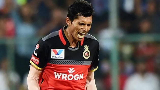 RCB bowler Navdeep Saini celebrate after taking wicket of KXIP batsman David Miller. (PTI) RCB bowler Navdeep Saini celebrate after taking wicket of KXIP batsman David Miller. (PTI)