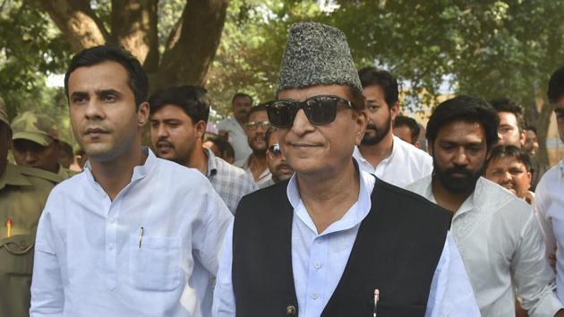 Samajwadi Party (SP) candidate from Rampur, Azam Khan, and his son Adeeb Azam Khan arrive to cast their vote, during the third phase of the 2019 Lok Sabha elections, at a polling station in Rampur, Tuesday, April 23, 2019. (PTI) Samajwadi Party (SP) candidate from Rampur, Azam Khan, and his son Adeeb Azam Khan arrive to cast their vote, during the third phase of the 2019 Lok Sabha elections, at a polling station in Rampur, Tuesday, April 23, 2019. (PTI)