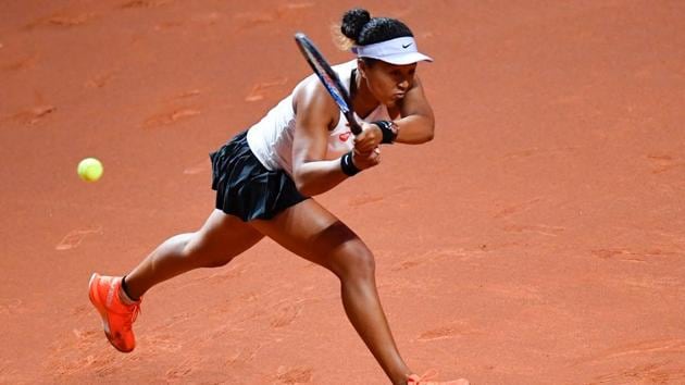 Japan's Naomi Osaka returns the ball to Taiwan's Su-Wei Hsieh.(AFP)