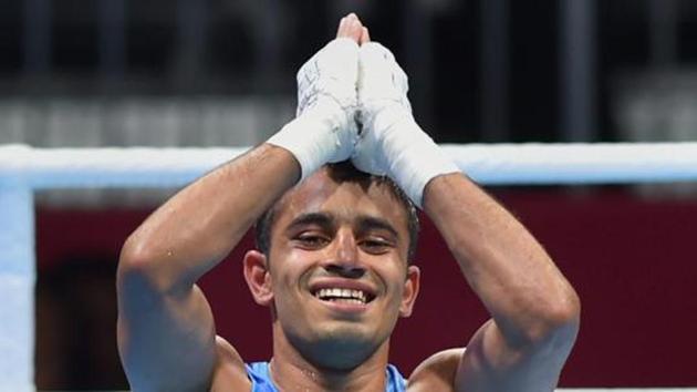 India's Amit Panghal (in blue) gestures after winning against Uzbekistan's Hasanboy Dusmatov. (PTI) India's Amit Panghal (in blue) gestures after winning against Uzbekistan's Hasanboy Dusmatov. (PTI)