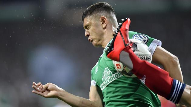 Bremen’s Milot Rashica ducks for a high kick from a Bayern player during the German soccer cup, DFB Pokal, semifinal match between Werder Bremen and Bayern Munich at the Weser stadium in Bremen, Germany. (Martin Meissner / AP) Bremen’s Milot Rashica ducks for a high kick from a Bayern player during the German soccer cup, DFB Pokal, semifinal match between Werder Bremen and Bayern Munich at the Weser stadium in Bremen, Germany. (Martin Meissner / AP)