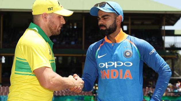 Aaron Finch of Australia and Virat Kohli of India take part in the coin toss.(Getty Images)