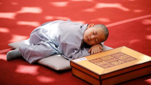 A novice monk naps after getting his head shaved by a Buddhist monk during an event to celebrate the arrival of Vesak Day, birthday of Buddha, at Jogye temple in Seoul, South Korea. (Kim Hong-Ji / REUTERS) A novice monk naps after getting his head shaved by a Buddhist monk during an event to celebrate the arrival of Vesak Day, birthday of Buddha, at Jogye temple in Seoul, South Korea. (Kim Hong-Ji / REUTERS)