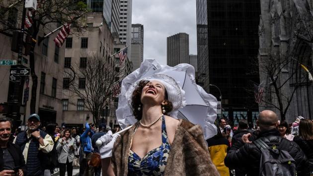 A woman reacts to the sun coming out of the clouds during the annual Easter Parade and Bonnet Festival on Fifth Avenue in New York City, New York. (Stephanie Keith / REUTERS) A woman reacts to the sun coming out of the clouds during the annual Easter Parade and Bonnet Festival on Fifth Avenue in New York City, New York. (Stephanie Keith / REUTERS)