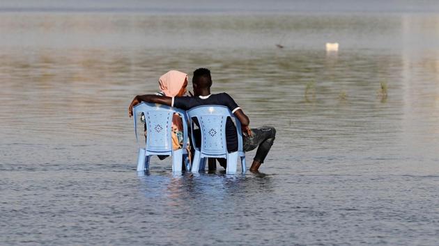 A Sudanese couple enjoy the shallow waters of the Nile River in Khartoum, Sudan. (Umit Bektas / REUTERS) A Sudanese couple enjoy the shallow waters of the Nile River in Khartoum, Sudan. (Umit Bektas / REUTERS)