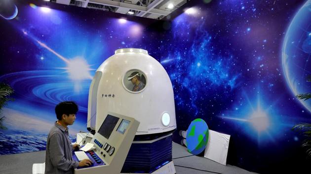 A man wears VR goggles at an exhibition to mark China's Space Day 2019. A handful of US small-rocket companies are developing launchers ahead of the expected boom. One of the biggest, Rocket Lab, has already put 25 satellites in orbit. No private company in China has yet. Since October, two - LandSpace and OneSpace - have tried but failed, illustrating the difficulties space start-ups face. (Aly Song / REUTERS)