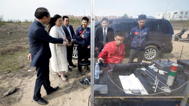 LinkSpace’s co-founder and CEO Hu Zhenyu (C), investors and officials visit the control console. After a surge in fresh funding in 2018, firms like LinkSpace are pushing out prototypes, planning tests and even proposing operational launches this year. At least 35 private Chinese companies are working to produce satellites. China’s state defence contractors are also trying to get into the market. (Jason Lee / REUTERS)