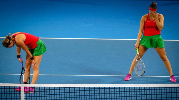 Victoria Azarenka (L) and Aryna Sabalenka of Belarus react to a point against Samantha Stosur and Ashleigh Barty of Australia during the Fed Cup tennis final doubles match between Australia and Belarus at the Pat Rafter Arena in Brisbane, Australia. (Patrick Hamilton / AFP) Victoria Azarenka (L) and Aryna Sabalenka of Belarus react to a point against Samantha Stosur and Ashleigh Barty of Australia during the Fed Cup tennis final doubles match between Australia and Belarus at the Pat Rafter Arena in Brisbane, Australia. (Patrick Hamilton / AFP)