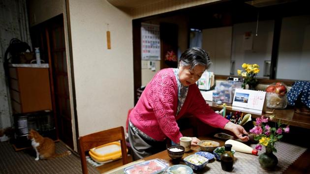 Fumiko Shirataki prepares her dinner at her home in Kawasaki. Shirataki won’t reveal how she and her fan friends figure out the royal schedules. But once she has the details, she loads a backpack, takes a collapsible chair and a rice ball to eat, and heads out. (Issei Kato / REUTERS) Fumiko Shirataki prepares her dinner at her home in Kawasaki. Shirataki won’t reveal how she and her fan friends figure out the royal schedules. But once she has the details, she loads a backpack, takes a collapsible chair and a rice ball to eat, and heads out. (Issei Kato / REUTERS)