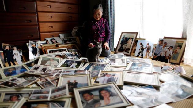 Fumiko Shirataki displays her collection of photographs of royal family members at her home. “As soon as I know their plans I’ll be there - though it’s hard if I only find out the night before.” she added. Shirataki’s passion for “okkake,” as the pursuit is known in Japan, began in 1993, when she followed then-Masako Owada after her engagement to Crown Prince Naruhito but couldn’t get good photos. (Issei Kato / REUTERS) Fumiko Shirataki displays her collection of photographs of royal family members at her home. “As soon as I know their plans I’ll be there - though it’s hard if I only find out the night before.” she added. Shirataki’s passion for “okkake,” as the pursuit is known in Japan, began in 1993, when she followed then-Masako Owada after her engagement to Crown Prince Naruhito but couldn’t get good photos. (Issei Kato / REUTERS)