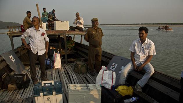 Indian election officials with polling materials travel on a country boat to reach a polling centre located in a remote river island, west of Guwahati, Assam. (Anupam Nath / AP) Indian election officials with polling materials travel on a country boat to reach a polling centre located in a remote river island, west of Guwahati, Assam. (Anupam Nath / AP)