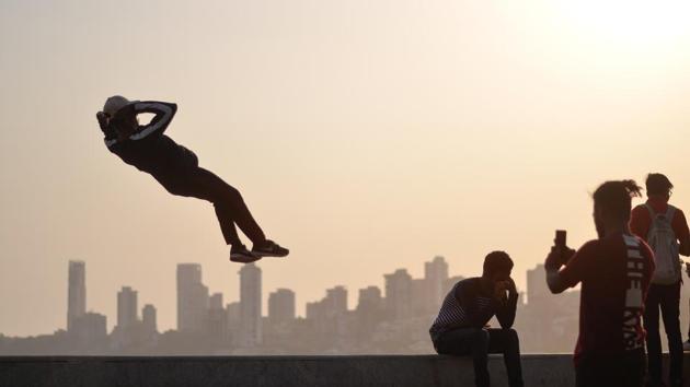 A boy leaps into the air, performing stunts at Marine Drive in Mumbai, Maharashtra. (Ragul Krishnan / HT Photo) A boy leaps into the air, performing stunts at Marine Drive in Mumbai, Maharashtra. (Ragul Krishnan / HT Photo)