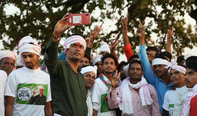 Galandar, Dungarpur, Rajasthan, India - April 25 : Kantilal Raot, the Bharatiya Tribal Party candidate from Banswara - Dungarpur lok sabha constituency, takes selfy with supporters at a public meeting n Dungarpur, Rajasthan, India on Thursday,, 25 April 2019. (Himanshu Vyas/Hindustan Times) Galandar, Dungarpur, Rajasthan, India - April 25 : Kantilal Raot, the Bharatiya Tribal Party candidate from Banswara - Dungarpur lok sabha constituency, takes selfy with supporters at a public meeting n Dungarpur, Rajasthan, India on Thursday,, 25 April 2019. (Himanshu Vyas/Hindustan Times)