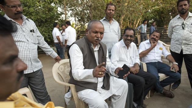 Baliram Jadhav with Daripada villagers during election campaign in Palghar district. (Satish Bate/HT Photo) Baliram Jadhav with Daripada villagers during election campaign in Palghar district. (Satish Bate/HT Photo)