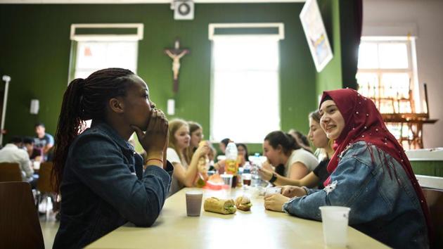 Young people attend a meeting between refugees and French children at a temporary accommodation for asylum seekers. As campaigning enters the final month before May’s European elections, the migrant question has been a central issue across a continent sharply divided over how to handle the influx of people seeking safety in Europe. (Sebastien Bozon / AFP) 
