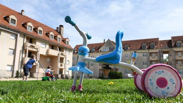 A tricycle is seen as children play. It was only after a squadron of gendarmes was relocated in 2015, leaving their former barracks empty, that regional officials approached the mayor with a request to use the premises as temporary accommodation for asylum seekers. And when Cohendet accepted, he found himself on the receiving end of some stiff opposition, even from members of his staff. (Sebastien Bozon / AFP) 