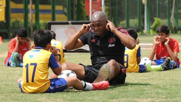 Former South African and Manchester United footballer Quinton Fortune gives tips to students from Shiv Nadar School during a training session, in Gurugram. Former South African and Manchester United footballer Quinton Fortune gives tips to students from Shiv Nadar School during a training session, in Gurugram.