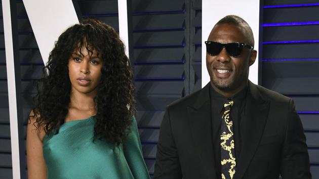 In this Feb. 24, 2019 file photo, Idris Elba, right, and Sabrina Dhowre arrive at the Vanity Fair Oscar Party in Beverly Hills, Calif. British actor Idris Elba has married model Sabrina Dhowre in Morocco.(Evan Agostini/Invision/AP)