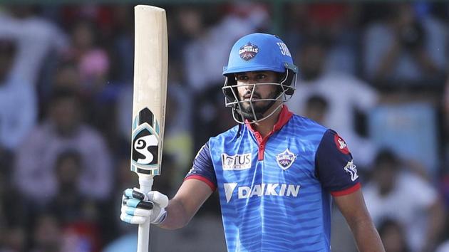 Delhi Capitals captain Shreyas Iyer raises his bat after scoring fifty runs. (AP)